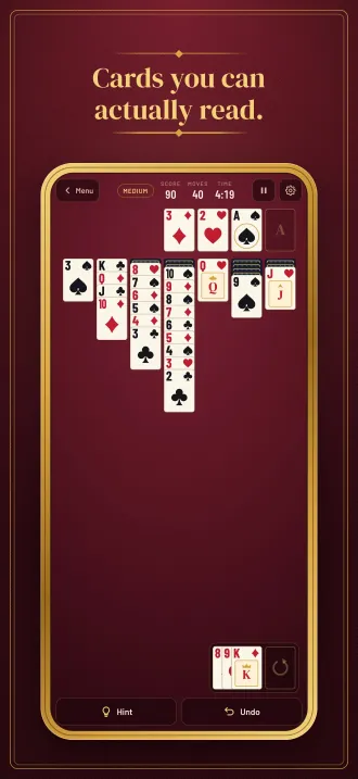 Screenshot, “Cards you can actually read.”: a game in play with long fanned columns and big corner numbers.