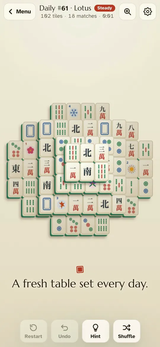 Teahouse Tiles on a phone: ivory tiles with large symbols, stacked in layers on a warm paper table.
